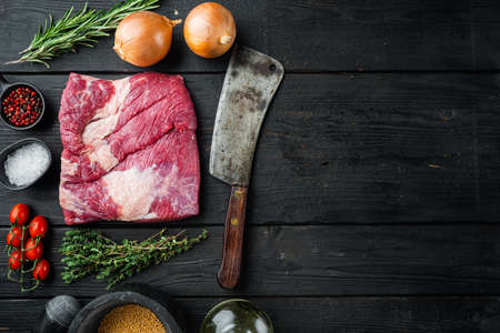 Beef navel, raw beef brisket meat set, with ingredients for smoking making barbecue, pastrami, cure, on black wooden table background, top view flat lay, with copy space for textの写真素材