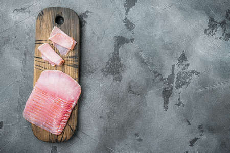 Curled Slices of Prosciutto set, on gray stone background, top view flat lay, with copy space for textの写真素材