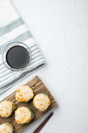 Fresh Sushi rolls with wasabi and ginger set, on white stone background, top view flat lay, with copyspace and space for textの写真素材