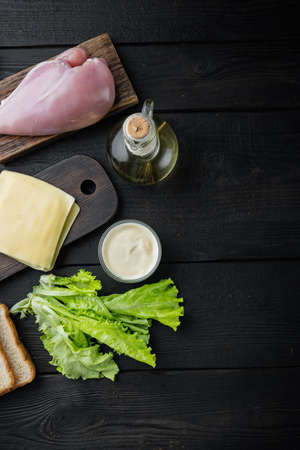 Club sandwich with fresh ingredient, on black wooden background, top view with copy space for textの写真素材