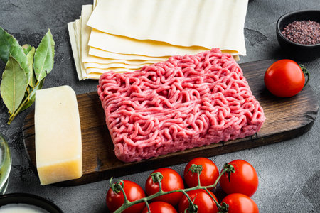 Ingredients for cooking lasagna. Recipe for homemade Italian lasagna with tomato sauce and meat set,...