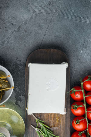 Homemade greek cheese feta set, on gray background, top view with copy space for textの写真素材