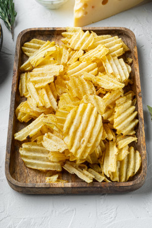 Home made potato chips set with Cheese and Onion, with dipping sauces tomato dip sour cream, on...