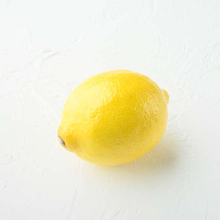 Ripe yellow lemon set, square format, on white stone backgroundの写真素材