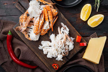 Ingredients for breakfast omelette with crab meat and cheese set, on dark wooden background, top view flat layの写真素材