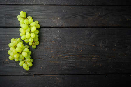 Shine Grape fruit set, green fruits, on black wooden table, top view flat lay, with copy space for textの写真素材