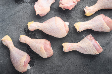 Fresh chicken meat cuts Farm poultry meat set, on gray stone background