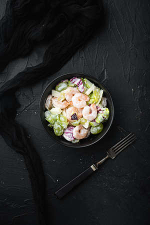 Prawn Waldorf salad set, with sauce apple and grape, on black stone background, top view flat lay, with copy space for textの写真素材