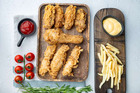 Crispy fried chicken parts on white background, flat lay.の写真素材