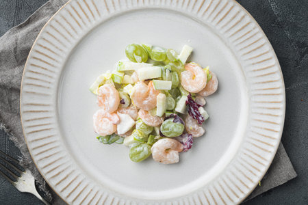 Salad of shrimp avocado, Prawn Waldorf set, with sauce apple and grape, on gray background, top view flat layの写真素材