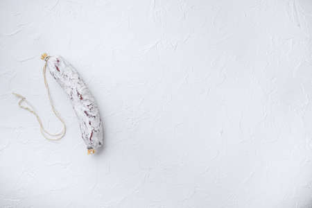 Salami sausage salchichon on white background with space for text.の写真素材