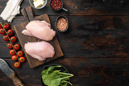 Chicken kiev ingredients with filo, fillet, herbs and butter set, on old dark wooden table background, top view flat lay, with copy space for textの写真素材