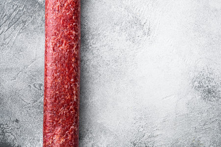 Sausage paperoni Salami with paprika set, on gray stone table background, top view flat lay, with...