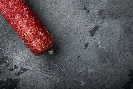 Sausage salami cured set, on gray stone table background, top view flat lay, with copy space for textの写真素材