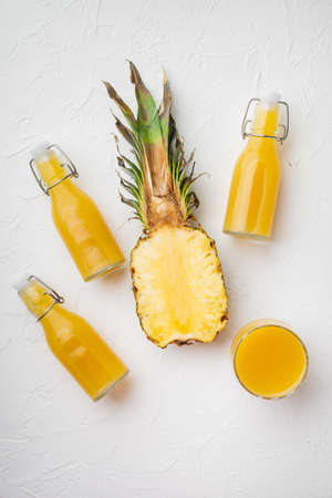Pineapple juice set, on white stone table background, top view flat layの写真素材