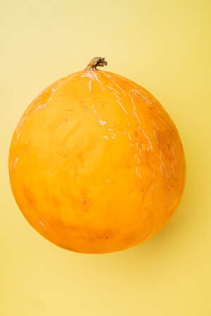 Honeydew melon set, on yellow textured summer backgroundの写真素材