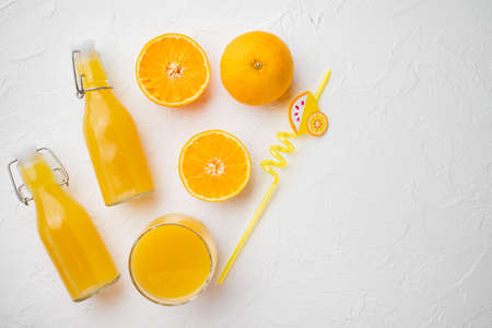 Tangerine juice set, on white stone table background, top view flat lay, with copy space for textの写真素材