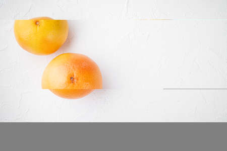 Grapefruit whole set, on white stone table background, top view flat lay, with copy space for textの写真素材