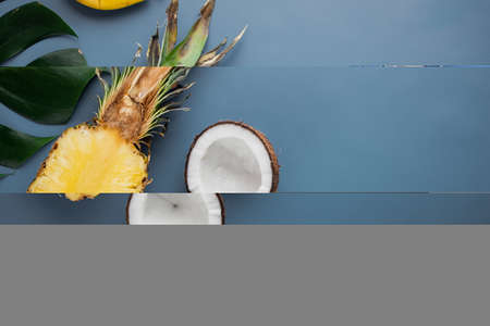 Fresh tropical fruit set, on blue textured summer background, top view flat lay, with copy space for textの写真素材