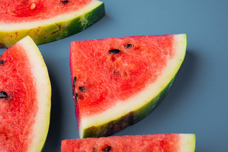 Half watermelon cut set, on blue textured summer background