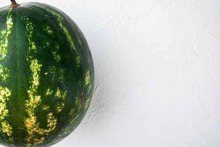 Watermelon whole set, on white stone table background, with copy space for textの写真素材