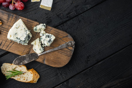 French roquefort cheese set, on black wooden table, flat lay with copy space for textの写真素材