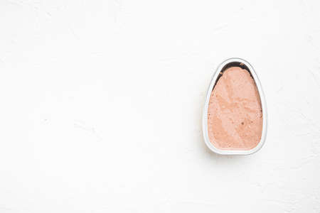 Chicken pate in opened aluminum packaging set, on white stone table background, top view flat lay, with copy space for textの写真素材