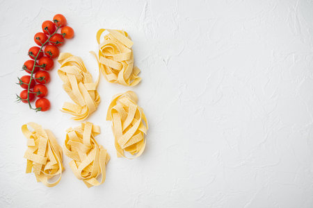 Italian food ingredients pasta set, on white stone table background, top view flat lay, with copy space for textの写真素材