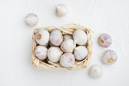 Baby garlic set, on white stone table background, top view flat lay