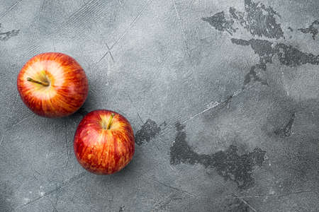 Fresh red apple set, on gray stone table background, top view flat lay, with copy space for textの写真素材