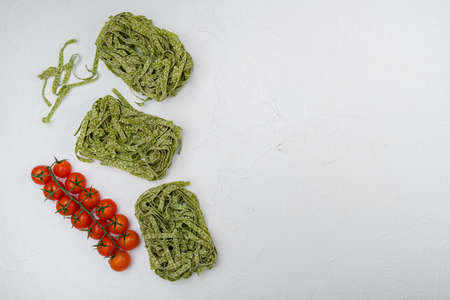 Green pasta ingredients set, on white stone table background, top view flat lay, with copy space for textの写真素材