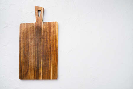 Bamboo kitchen cutting board set empty for empty for copy space for text or food, top view flat lay, on white stone table backgroundの写真素材