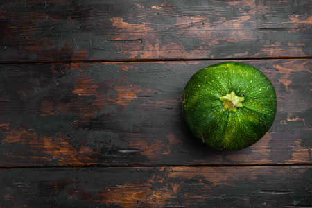 Ripe Zucchini set, on old dark wooden table background, top view flat lay, with copy space for textの写真素材