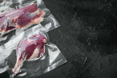 Duck meat, seasoned raw freshly slaughtered by the bio farm prepared for vacuuming and smoking set, on black stone background, with copyspace and space for textの写真素材
