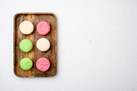 Dessert cake macaron or macaroon set, on white stone table background, top view flat lay, with copy space for textの写真素材