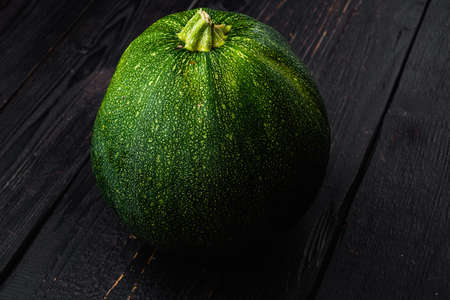 Fresh vegetable Zucchini set, on black wooden table backgroundの写真素材