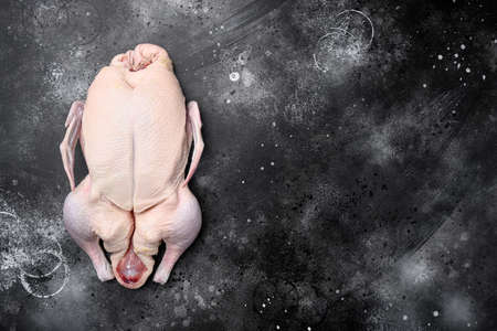 Raw whole Duck meat set, on black dark stone table background, top view flat lay, with copy space for textの写真素材