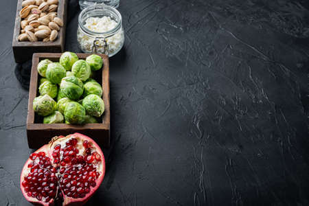 Gnarly garlic Brussels ingredient on black textured background with space for textの写真素材