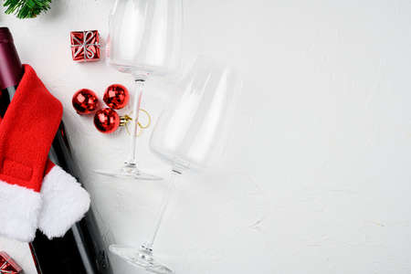 Christmas tree branches wine set, on white stone table background, top view flat lay, with copy space for textの写真素材