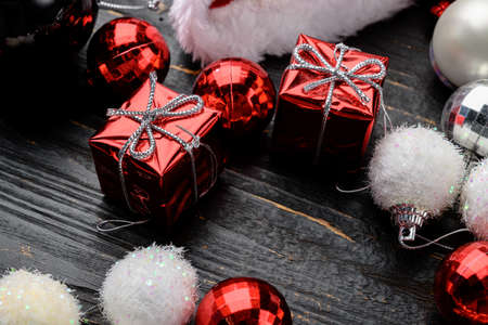Christmas baubles and toys set, on black wooden table backgroundの写真素材