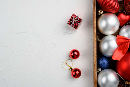 Christmas composition for gift postcard set, in wooden box, top view flat lay, on white stone table background, with copy space for textの写真素材