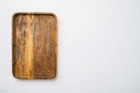 Paddle cutting or serving board set, top view flat lay, with copy space for text or your product, on white stone table backgroundの写真素材