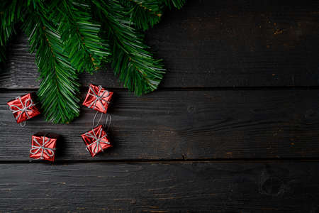 Christmas tree decoration set, top view flat lay, on black wooden table background, with copy space for textの写真素材