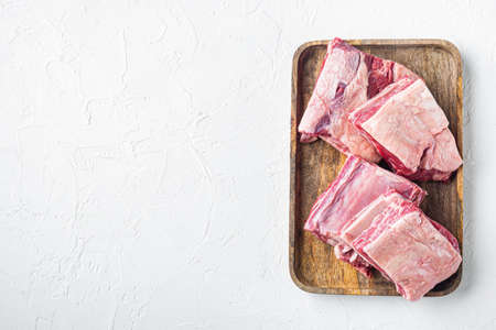 Raw beef short rib set, on white stone background, top view flat lay, with copy space for textの写真素材