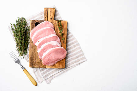 Raw pork steak meat set, on white stone table background, top view flat lay, with copy space for textの写真素材