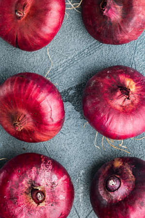 Red onion, on gray background, top view flat layの写真素材