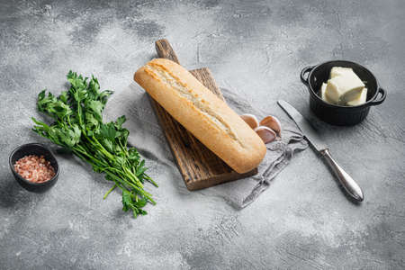 Baguette parsley herbs butter ingredients set, on gray stone table background, with copy space for textの写真素材