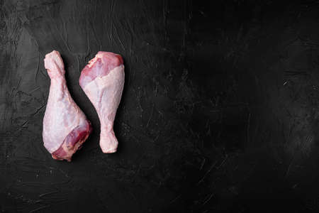 Raw turkey hen meat set, on black dark stone table background, top view flat lay, with copy space for textの写真素材
