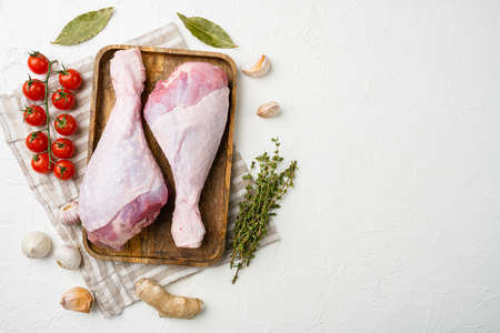 Raw turkey hen meat set, on white stone table background, top view flat lay, with copy space for textの写真素材