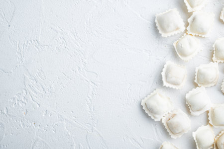 Frozen dumplings tortellini and ravioli set, on white background, top view flat lay, with copyspace and space for textの写真素材
